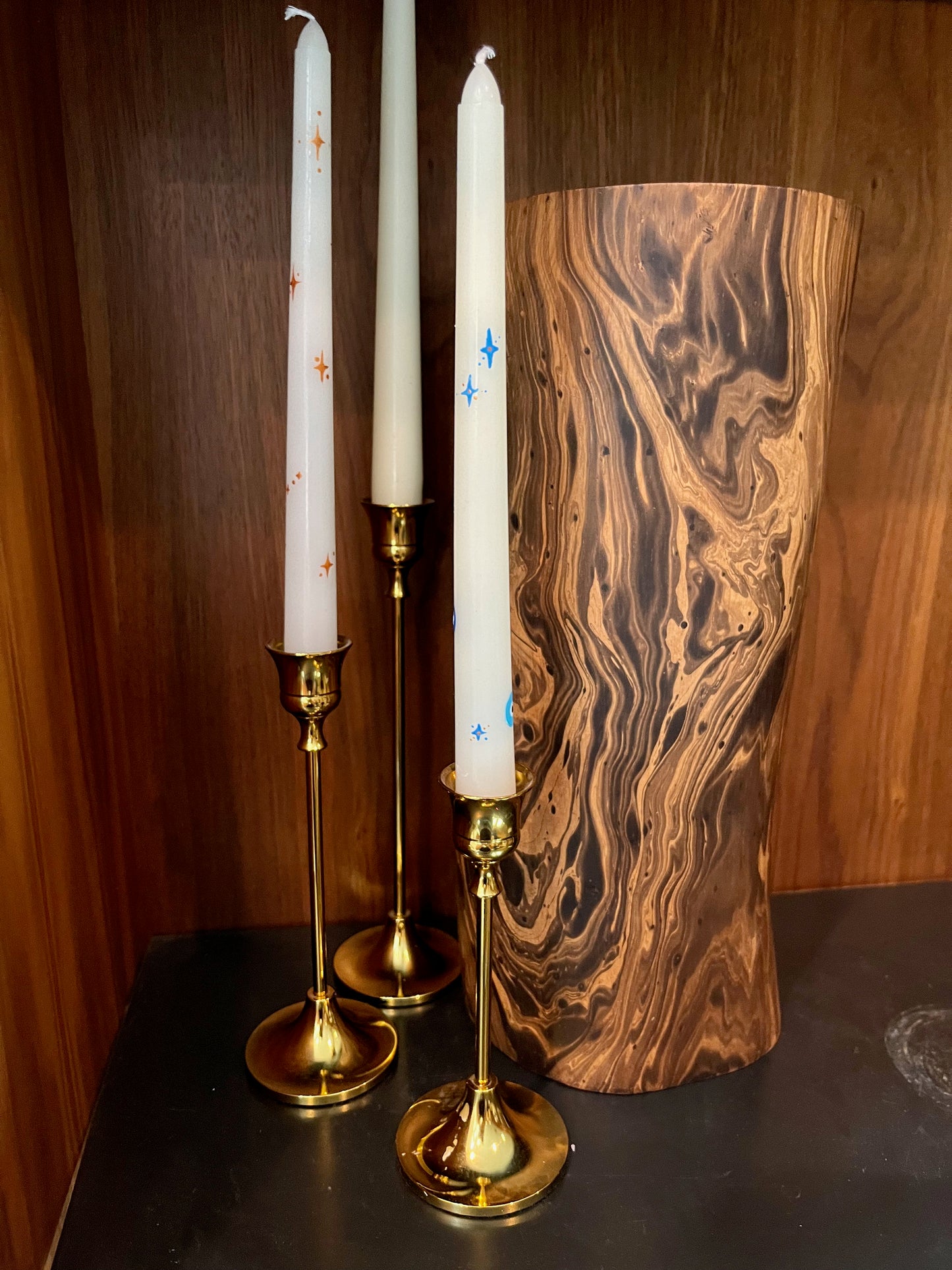 multicolored evil eye and star taper candle