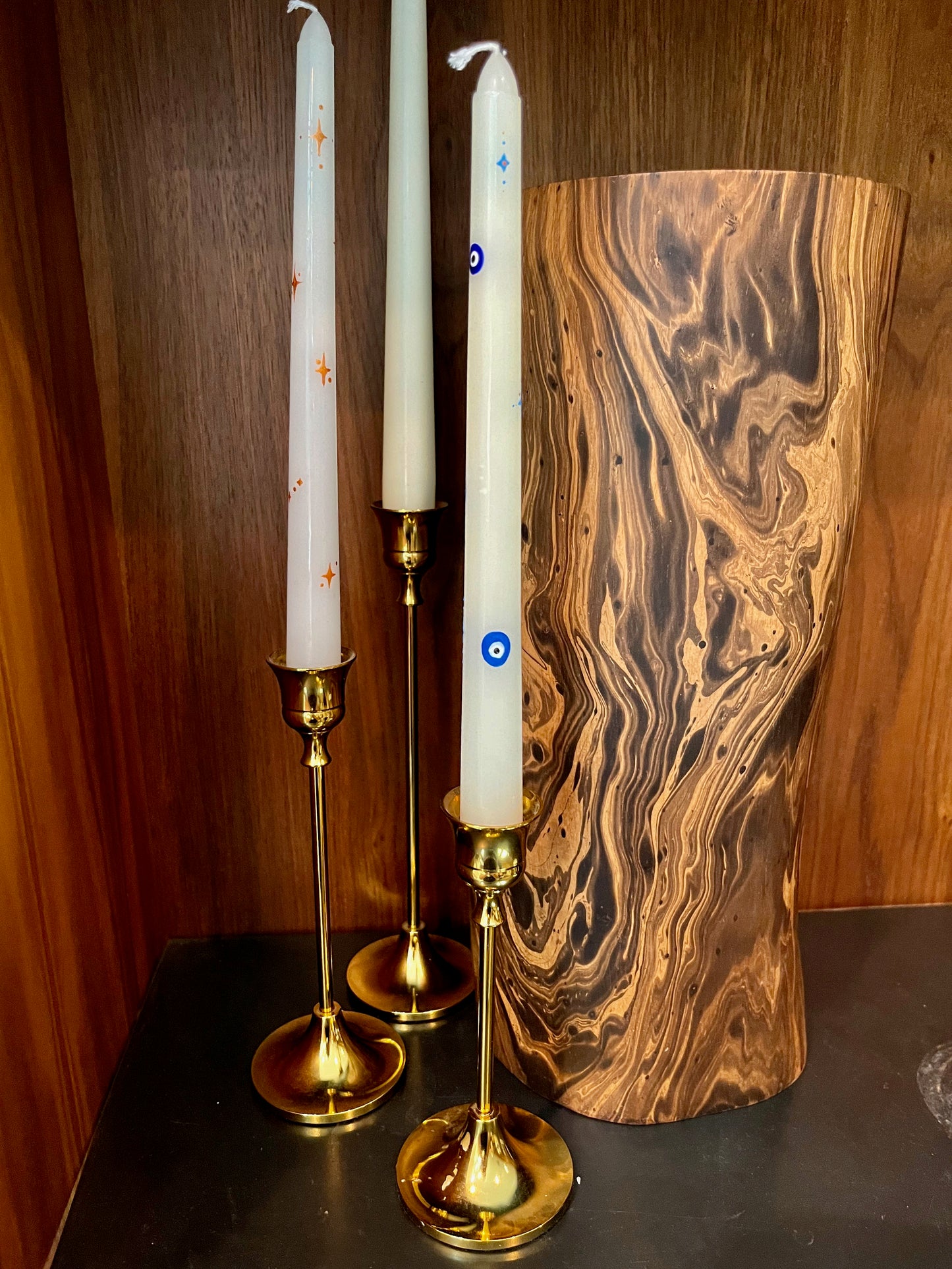 multicolored evil eye and star taper candle